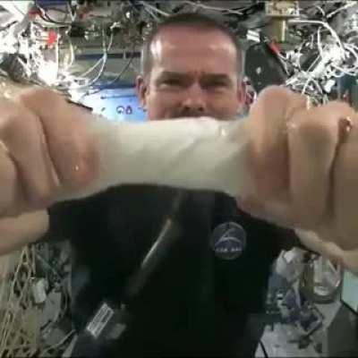 This is what happens when you wring out a wet towel while floating in space.