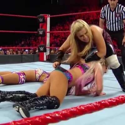 Natalya giving Alexa Bliss a wedgie