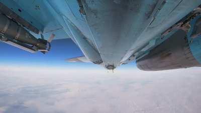 Su-34 dropping a pair of glide bombs near Kupyansk