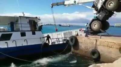 Loading a container on a ship