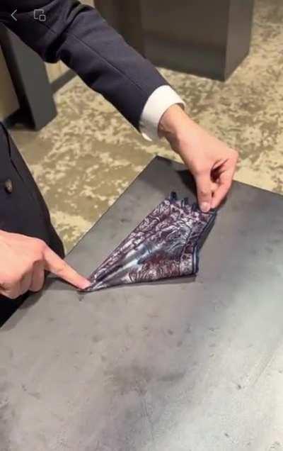 Folding a handkerchief