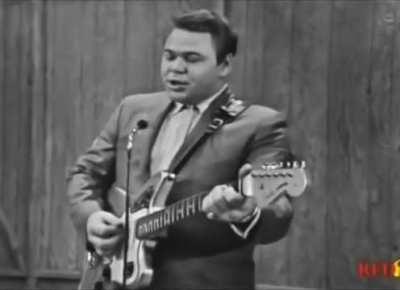 Roy Clark in 1964, performing a more comedic rendition of Johnny Cash's 