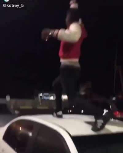 Guy gets karma'd on his butt after walking on cars