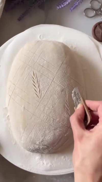 Rachel Pardoe is a gifted bread artist renowned for her stunning sourdough masterpieces. Her creations frequently exhibit intricate designs and patterns, highlighting her expertise in both baking and visual artistry. 