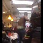 Man hops behind the counter at a restaurant, Good Samaritan intervenes and attempts to stop him