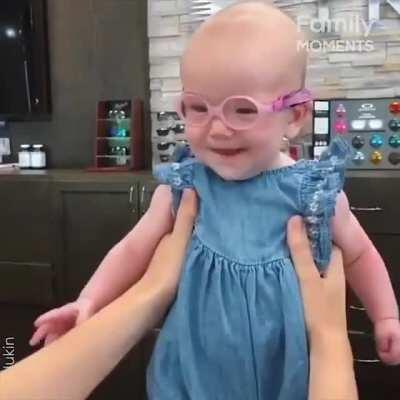 Baby girl sees Mom for the first time after wearing glasses