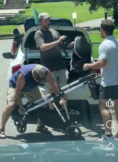 How many men does it take to fold a stroller?