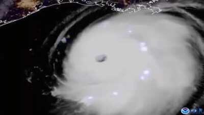 Satellite video footage by NOAA showing the lightning inside Hurricane Laura