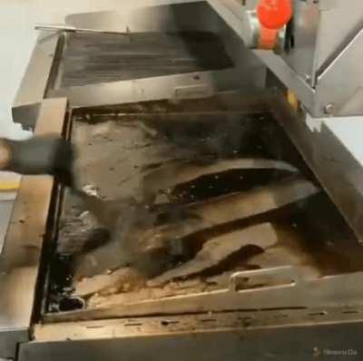 Cleaning a cooking station