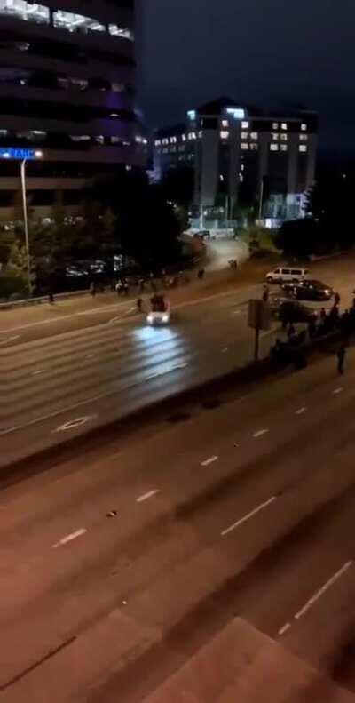 People protesting in the middle of the night on a freeway get hit by car