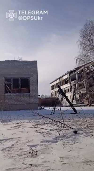 In Bakhmut, a Ukrainian mortar team of the State Border Guard Service gets interrupted by Russian artillery. After the impact, they continue their work.