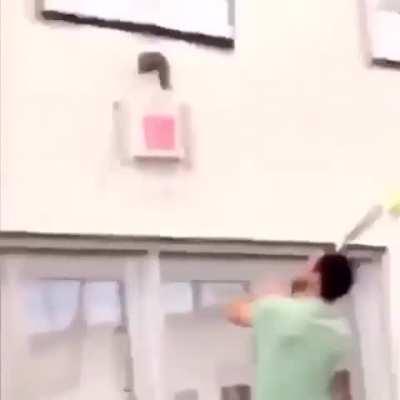 frantically attempting to remove this enormous dildo from the wall of this school gym