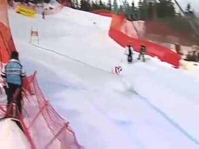 Yannick Bertand collides with a Super-G gate