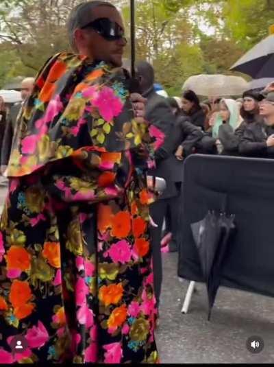 A not so impressed security guard at Paris Fashion Week