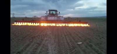 Flame weeding using a tractor