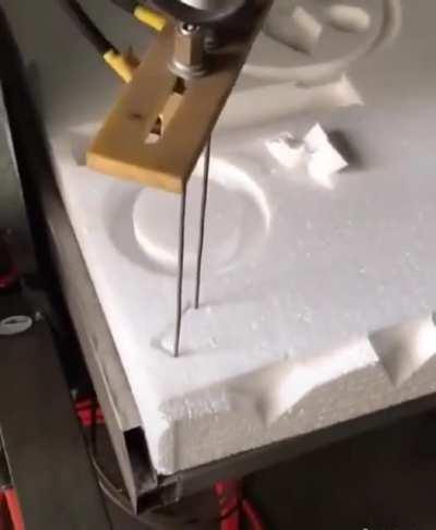 Wire cutting a foam board with precision.