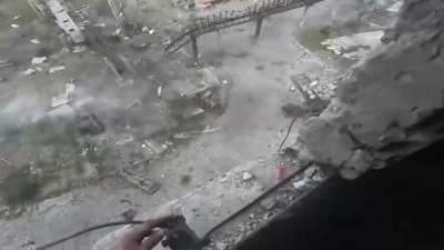 Ukrainian soldier shooting out the window at Russian infantry storming his building in Vuhledar, Donetsk [Sept 2024]