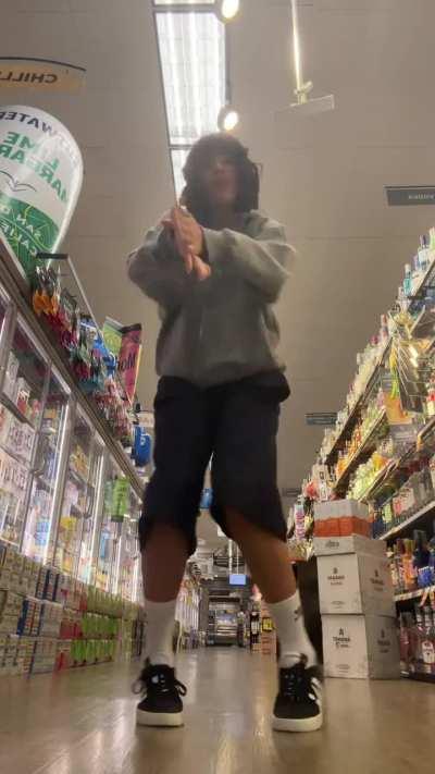 Xochitl Gomez dancing in the grocery store