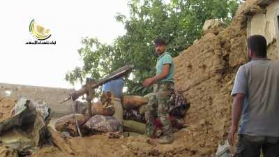 FSA fighters chip away at Syrian Army controlled buildings using an improvised launcher - Daraya - 9/17/2014