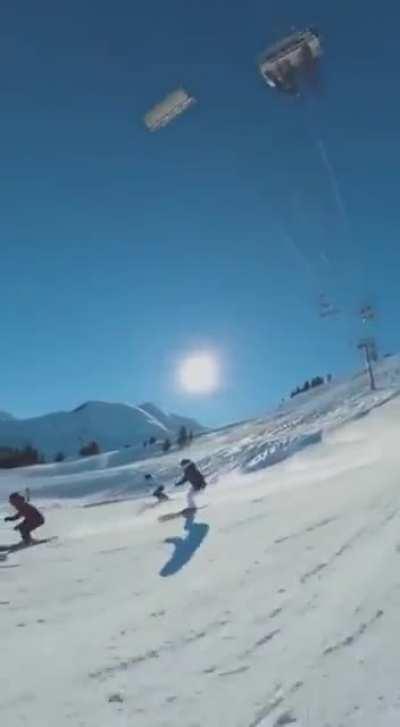 This incredible cameraman films while skiing quickly down a hill