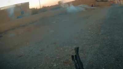 HTS fighter hip fires a light machine gun and kills a Daesh militant at close range. Hama, Syria 2017 NSFW