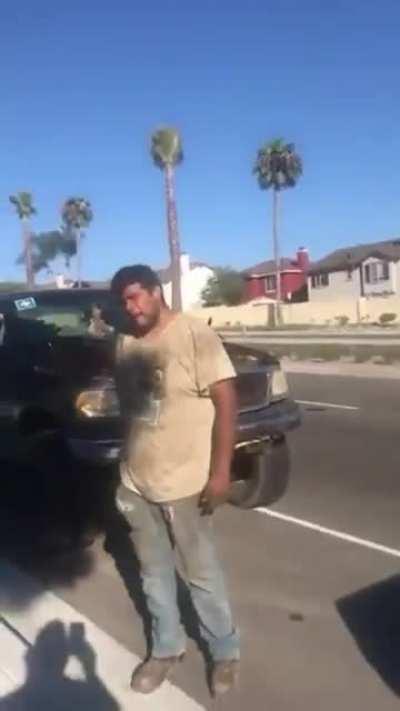 Man CONFIDENTLY tries to steal someone's tire while owner is present.