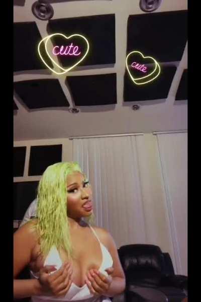 Nicki Minaj juggling her big tits until her areola peaks out on ig