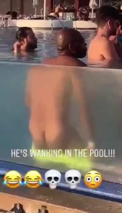 Dude jerking off in a pool, doesn’t realize that there’s a transparent glass behind him.