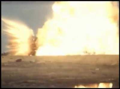 Ground test of a bunker-buster warhead going through reinforced concrete before detonating