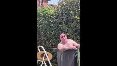 Man having a cocktail in his bin