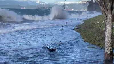 The Seawall getting battered by waves.