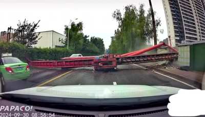 Crane collapses on the road