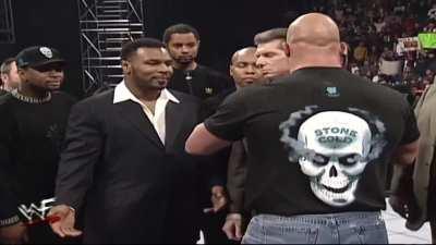 Stone Cold Steve Austin gives Mike Tyson the bird. 1/19/1998