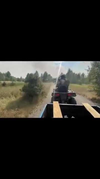 Ukrainian special forces doing a driveby on Russians from an ATV and clearing an abandoned position