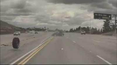 Kia soul goes flying when runaway tire hits it on the highway