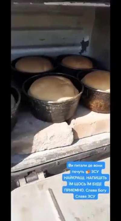 Ukrainian soliders making and baking bread on the frontline.