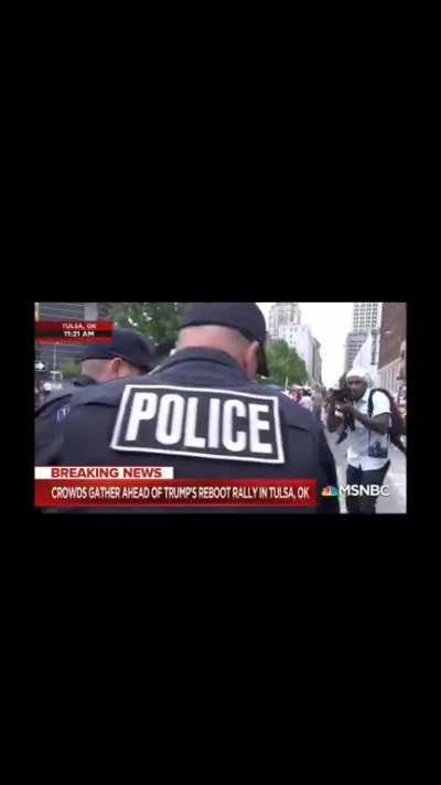 Woman peacefully protesting at Trump rally removed by Tusla police officers. Even though she had a ticket.