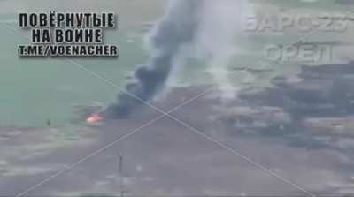 A Russian vehicle drives over a mine and explodes spectacularly. 