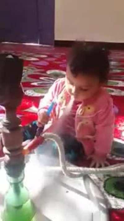 Letting a child use a shisha which can harm your lung.