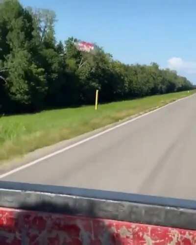 Aerodynamic drag pulling this plastic bottle behind a pick up truck