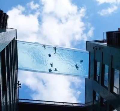 The world's first suspended 'sky pool' opens in embassy garden, London.