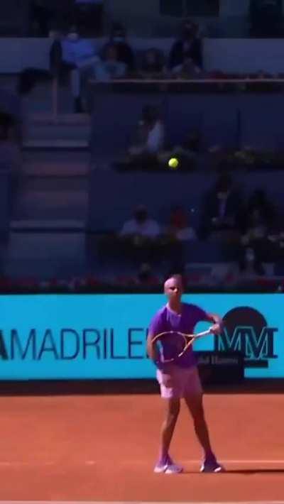 Rafael Nadal catches opponent's shot with his racket