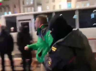 A protester in Russia shouting &quot;Arrest Putin, Not Me&quot; during arrest.