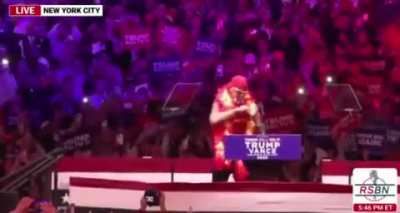 Hulk Hogan struggling to tear off his shirt at the Trump Madison Square Garden rally