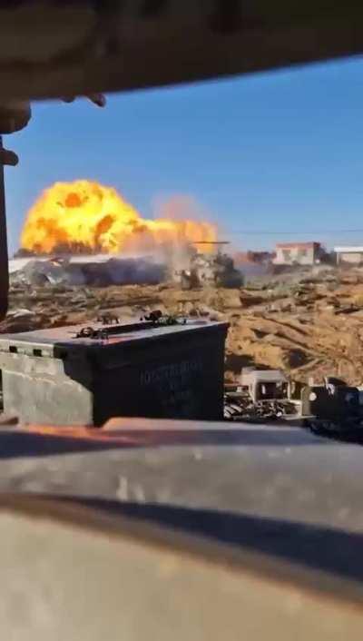 A IDF tank fires and something blows up, claimed to be the Abu Jared gas station in east Rafah