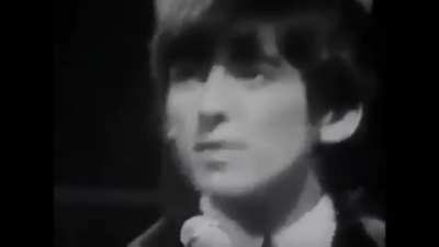 A clip of George singing Roll Over Beethoven