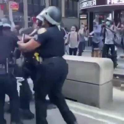 low IQ think jumping on a police car is OK cause he's wearing a mask .........WCGW.