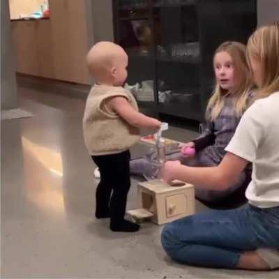 These big sisters were overjoyed to see their baby brother's first steps