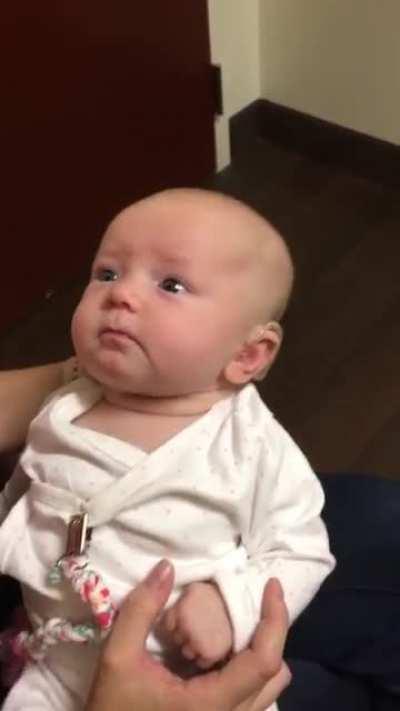 Baby hears mothers voice for the first time with the help of a hearing aid. the reaction is beautiful.