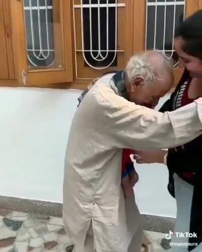 A grandpa meet his grandson for the first time